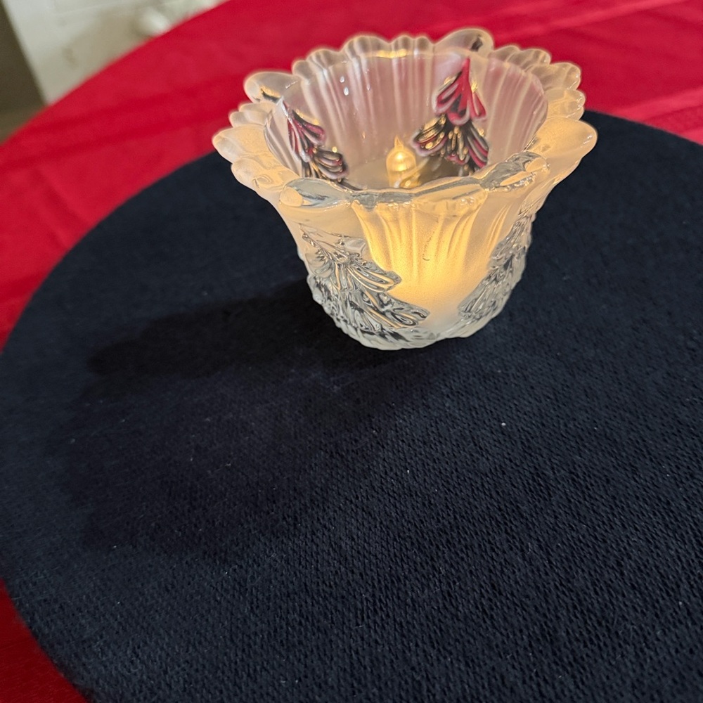 This is a Mikasa Winter Dream frosted crystal votive holder.